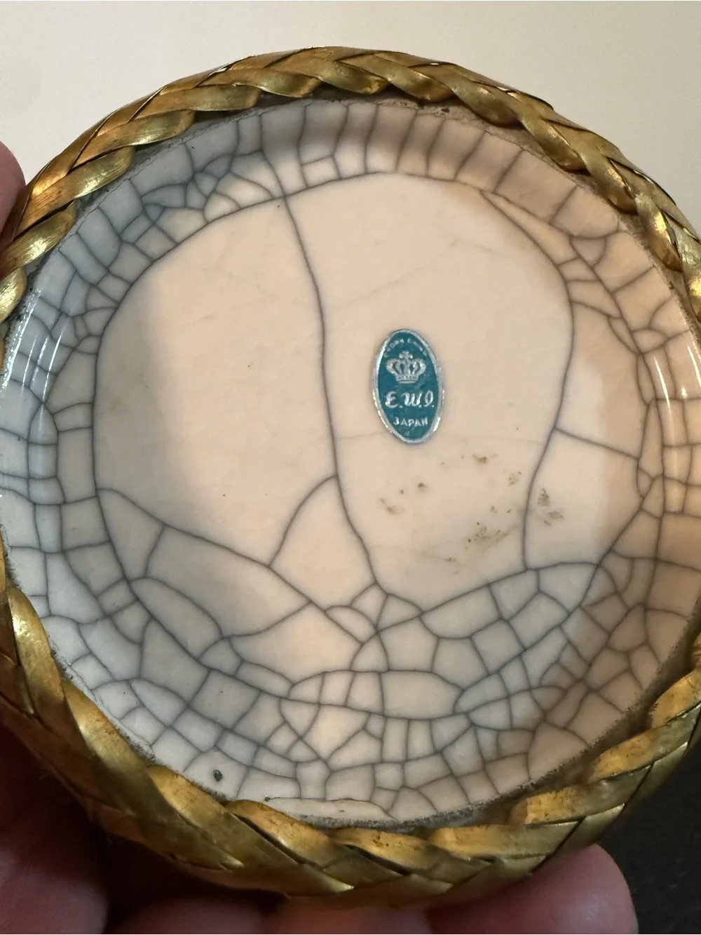 Japanese pottery vase craquelure glaze and a basketweave metal overlay.